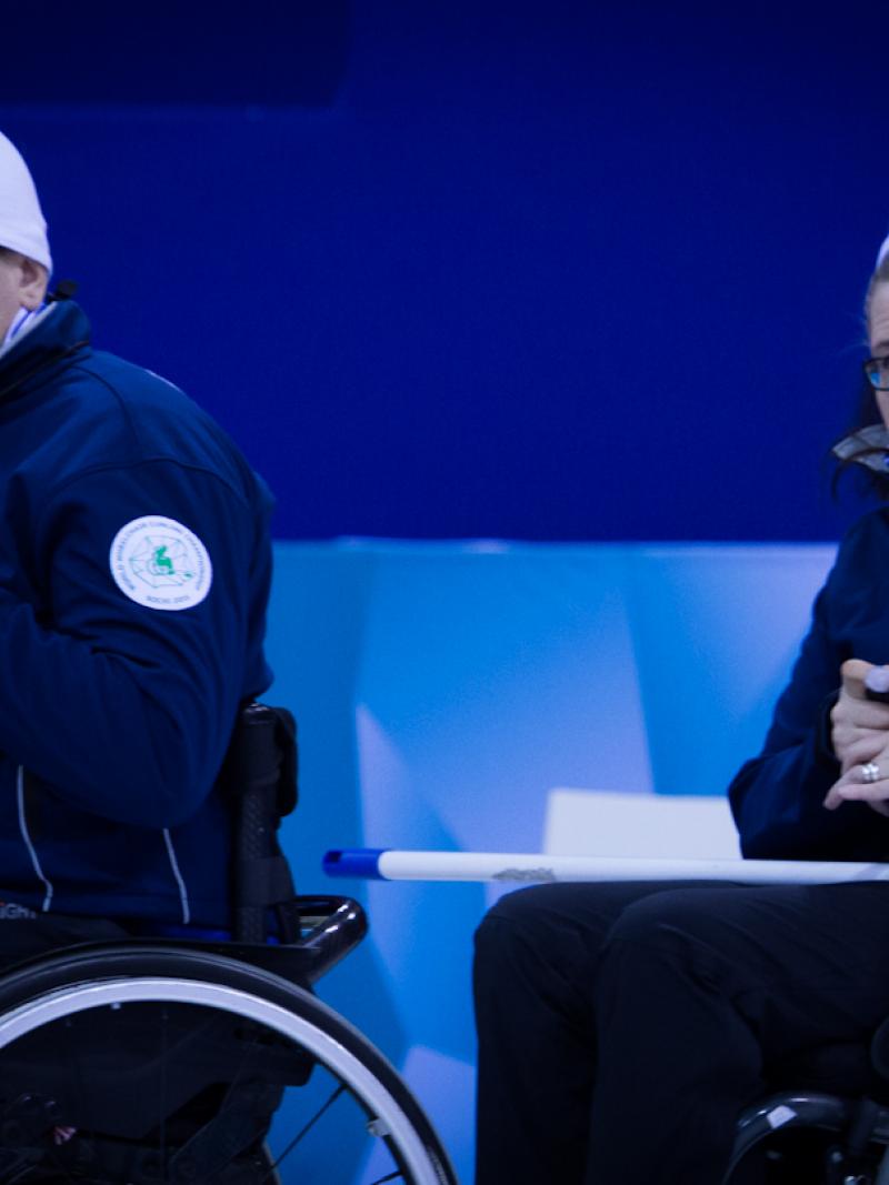 A picture of a man and a woman in wheelchairs