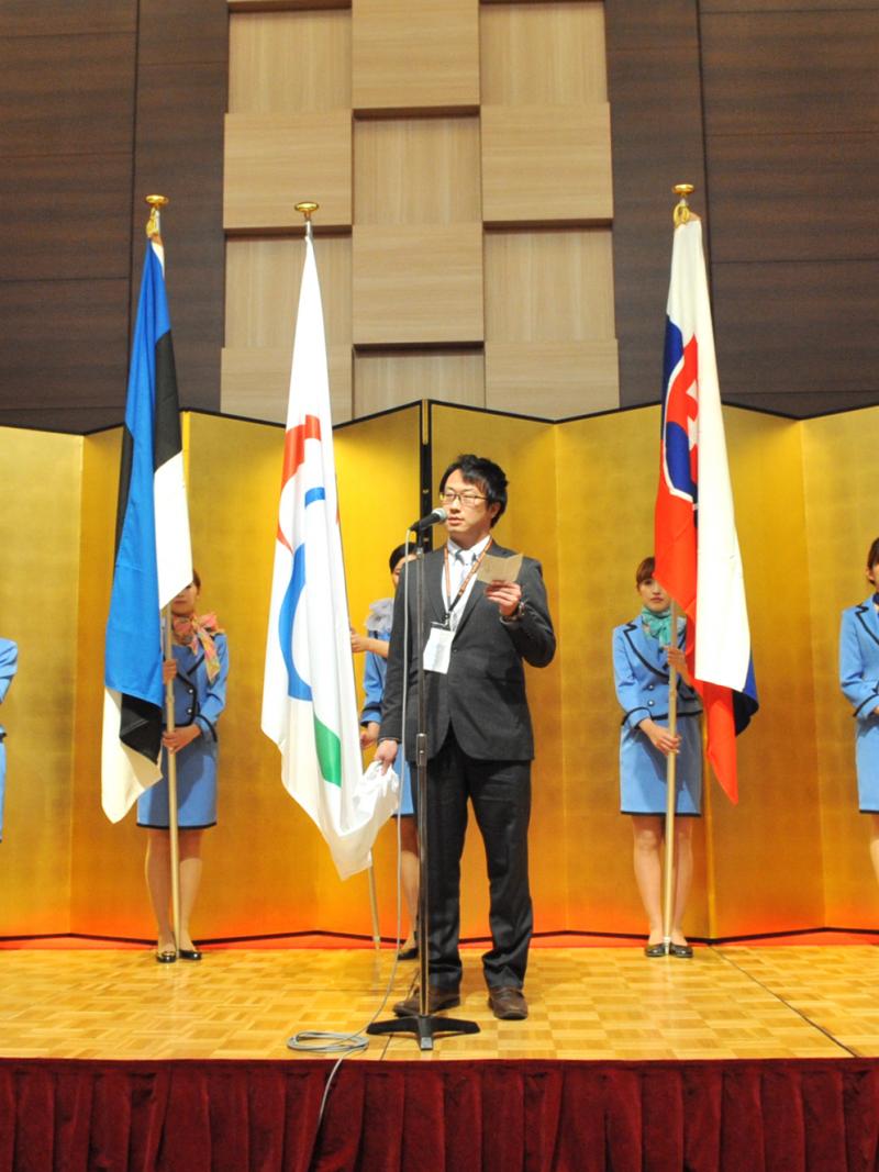 A picture of man talking during a speech