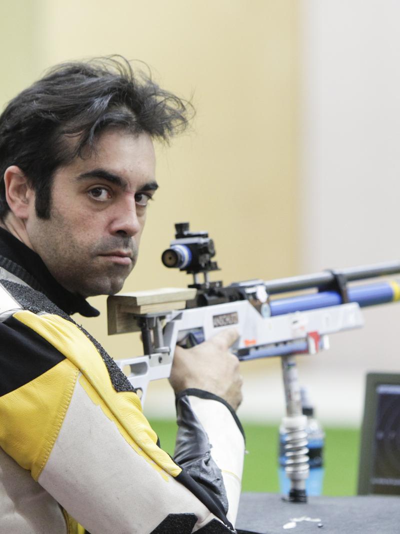 A picture of a man posing during the shooting competition