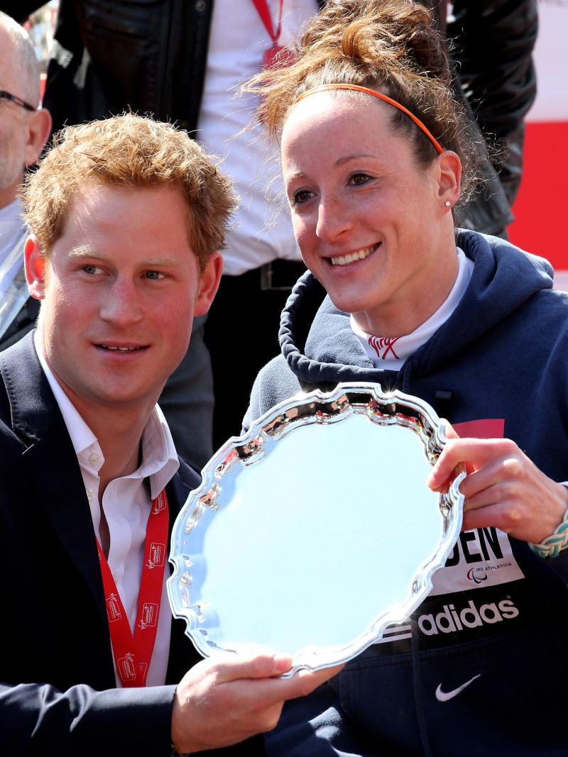 Prince Harry presents Tatyana McFadden with her 2013 London Marathon trophy