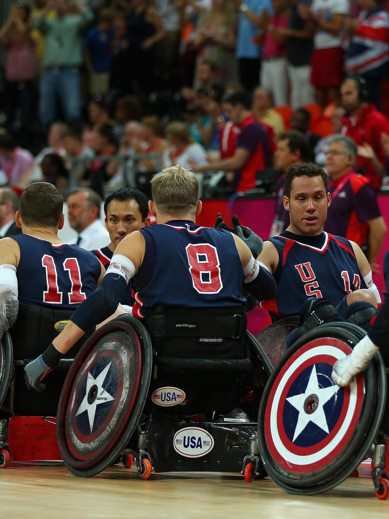 Players in wheelchairs lining up and high five