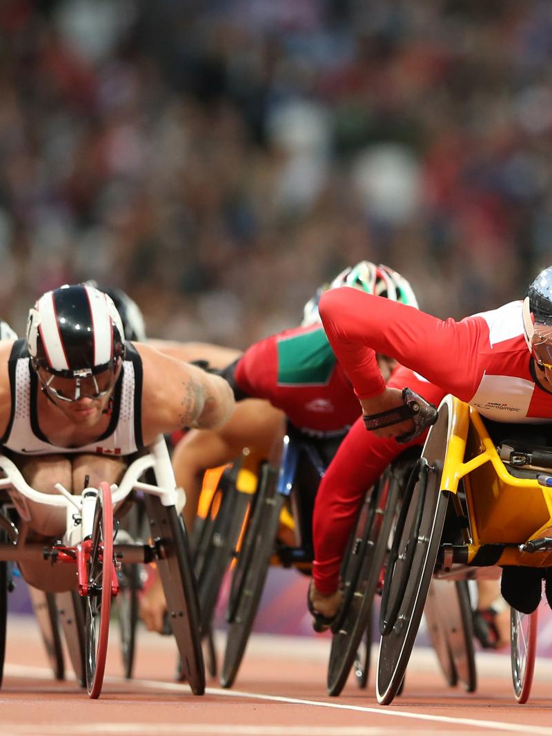 Marcel Hug of Switzerland (R) and Josh Cassidy of Canada compete in the Men's 5000m - T54 heats on day two of the London 2012 Paralympic Games at Olympic Stadium.