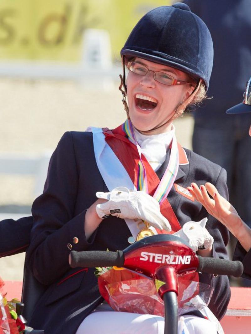 Grade 1a Freestyle gold medallist Sophie Christiansen (GBR), celebrating with compatriot Anne Dunham who took silver and bronze medallist Sara Morganti (ITA), at the JYSK FEI European Para-Dressage Championships in Herning (DEN).