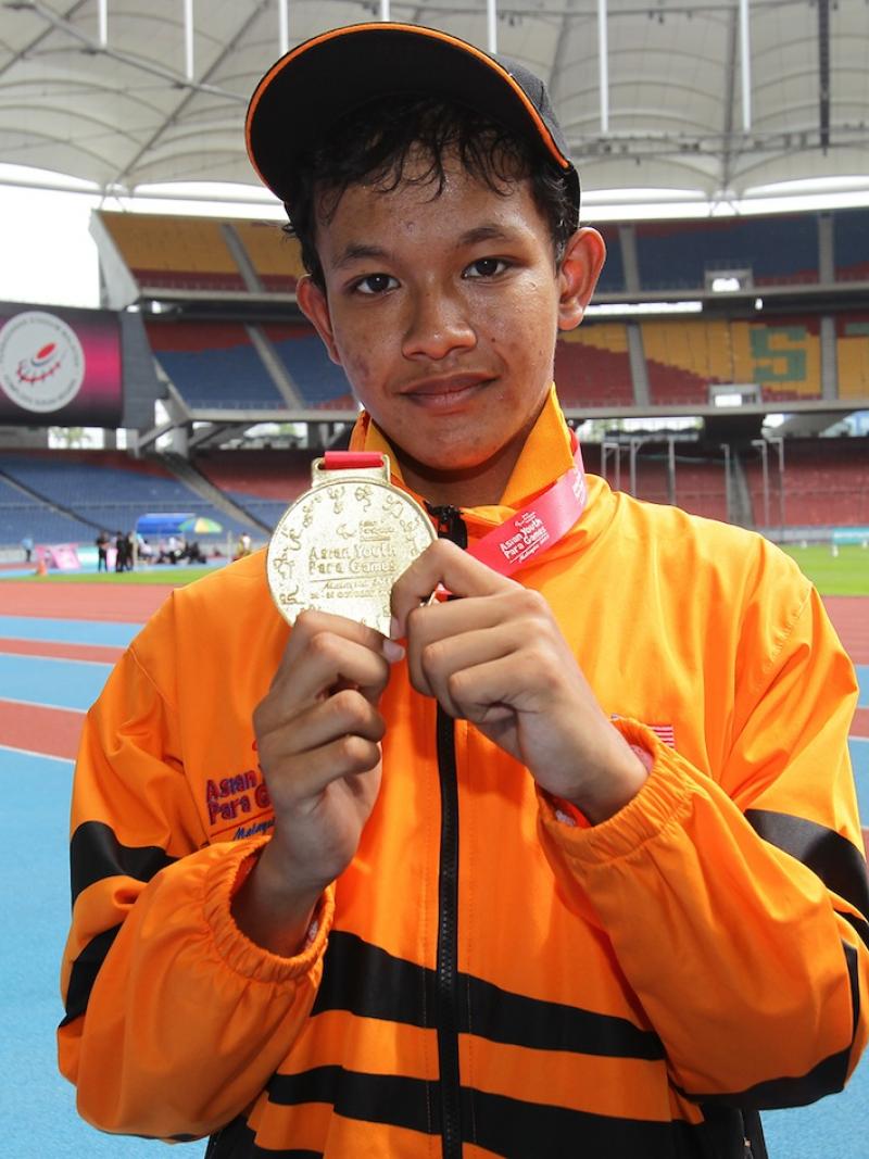 Fitri Ghani wins the first gold at the Athletics venue at the 2013 Asian Youth Para Games