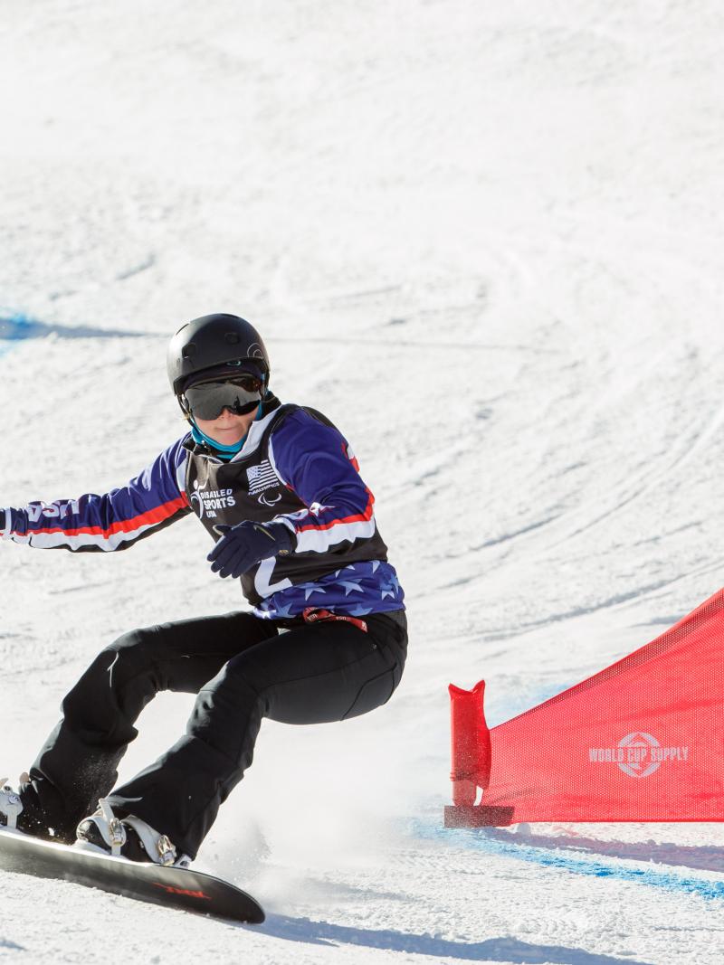 Heid-Jo Duce on her snowboard at a slalom event.