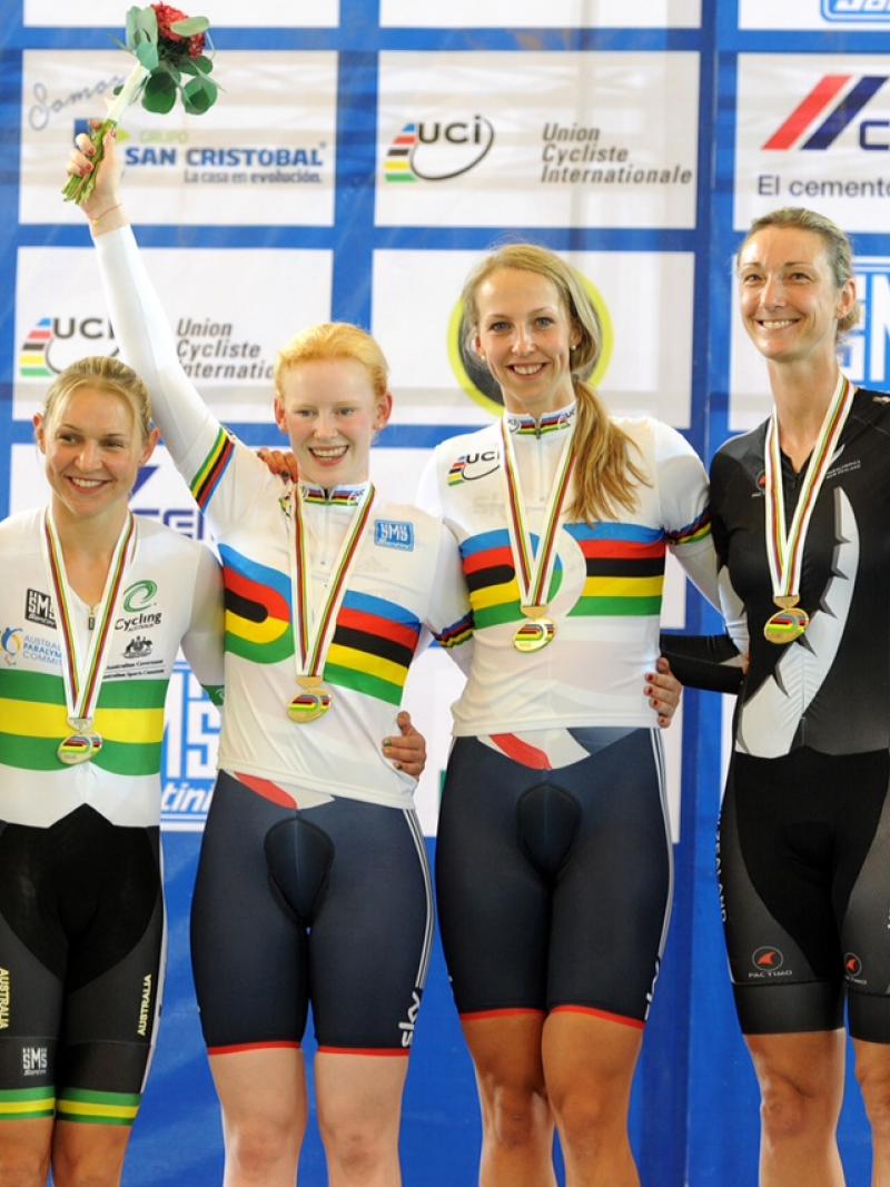 Sophie Thornhill and pilot Rachel James in their rainbow tops stand top of the podium after victory in Mexico