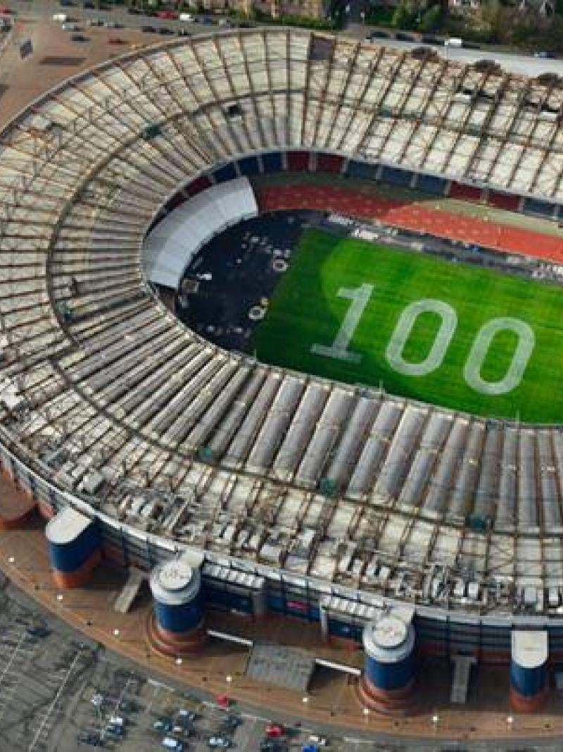 Picture of Glasgow 2014 stadium with 100 days to go written in the grass
