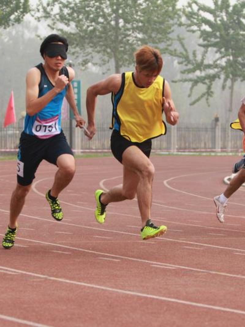 Athletes with a visual impairment compete in the 100m at the 2014 IPC Athletics Grand Prix in Beijing.
