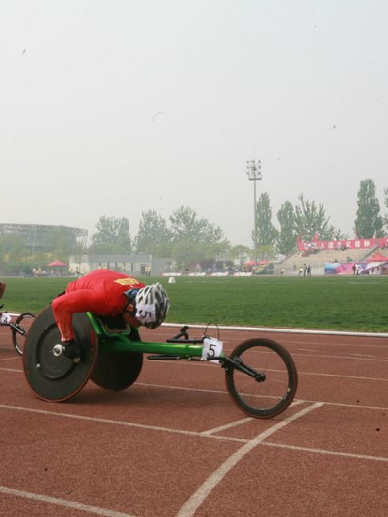 Athletes compete in a wheelchair race at the 2014 IPC Athletics Grand Prix in Beijing