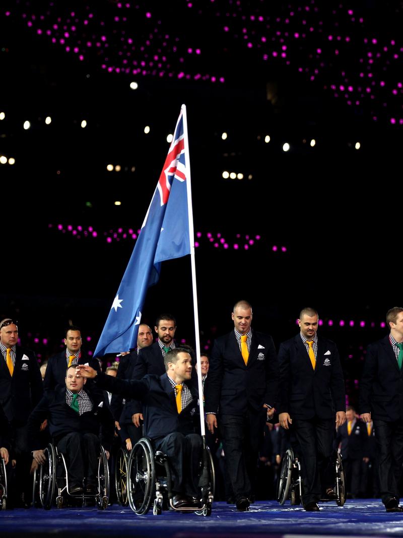 An athlete carries Australia's flag through the stadium at the London 2012 Opening Ceremony.