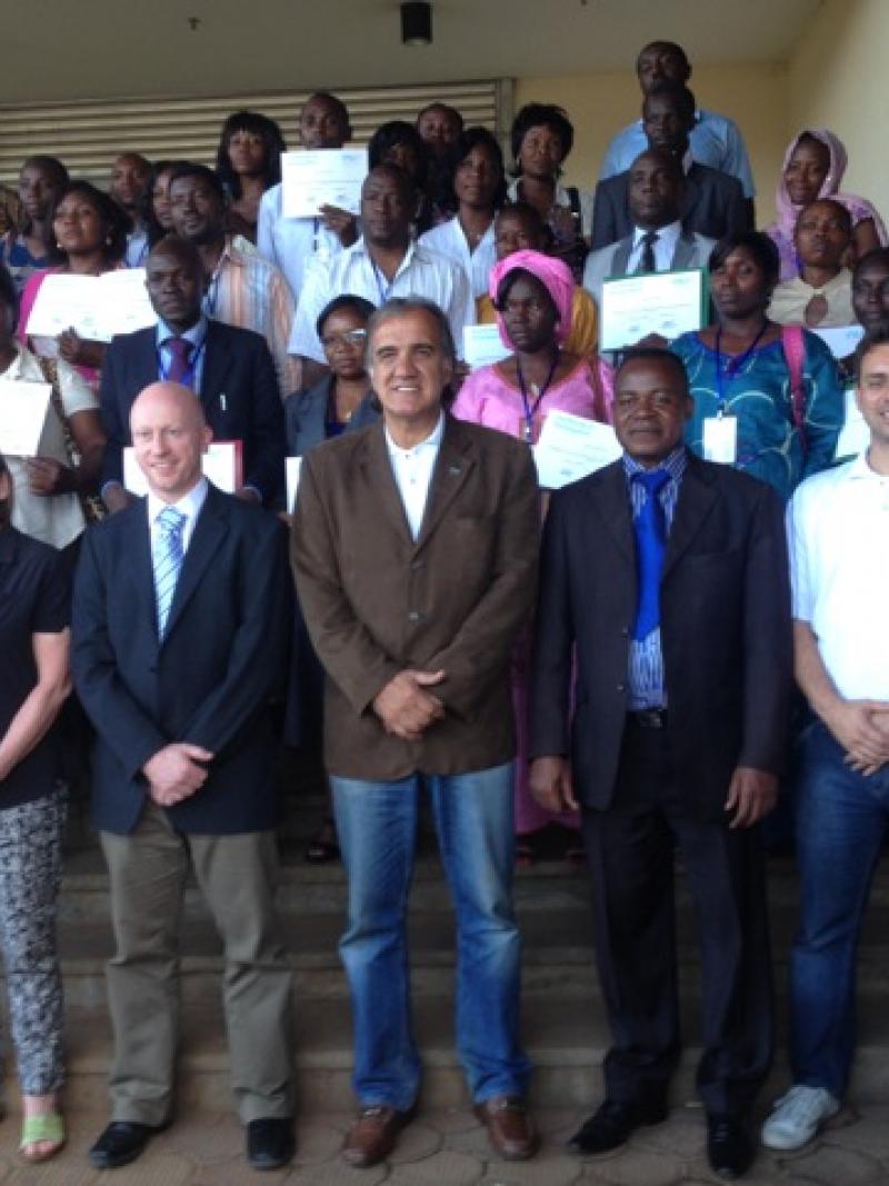 A group of about 40 people pose for a photo after a workshop.
