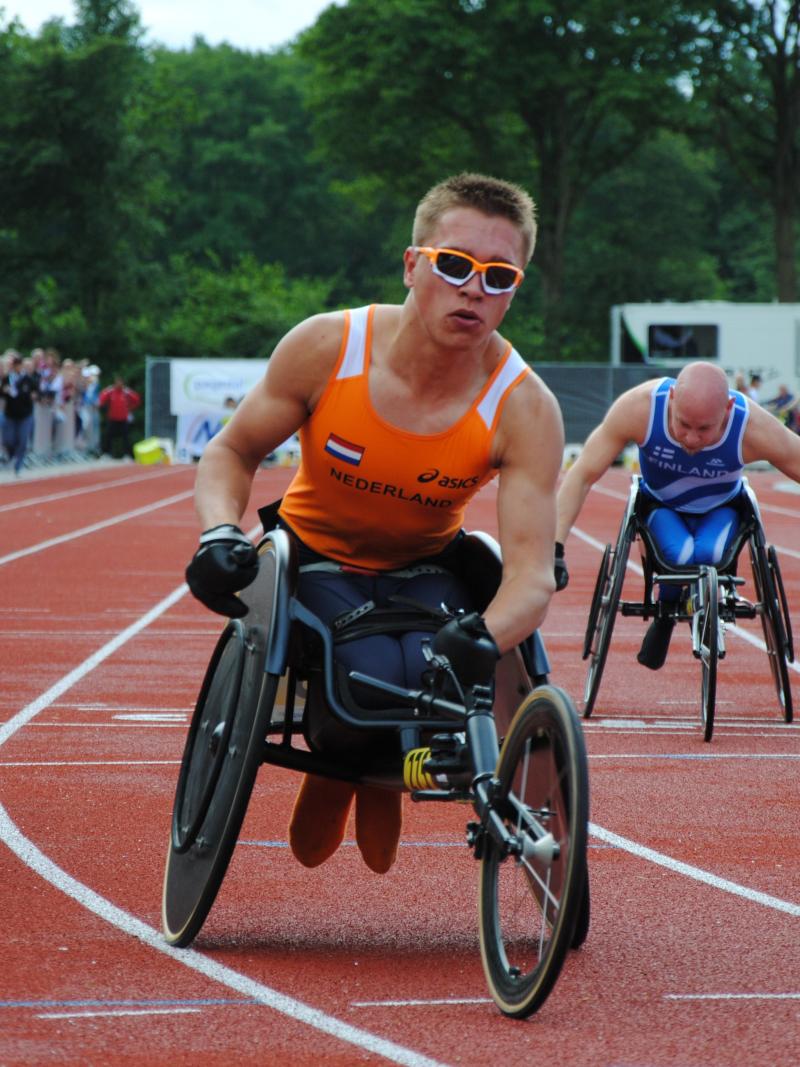 Wheelchair racer crosses the finish line