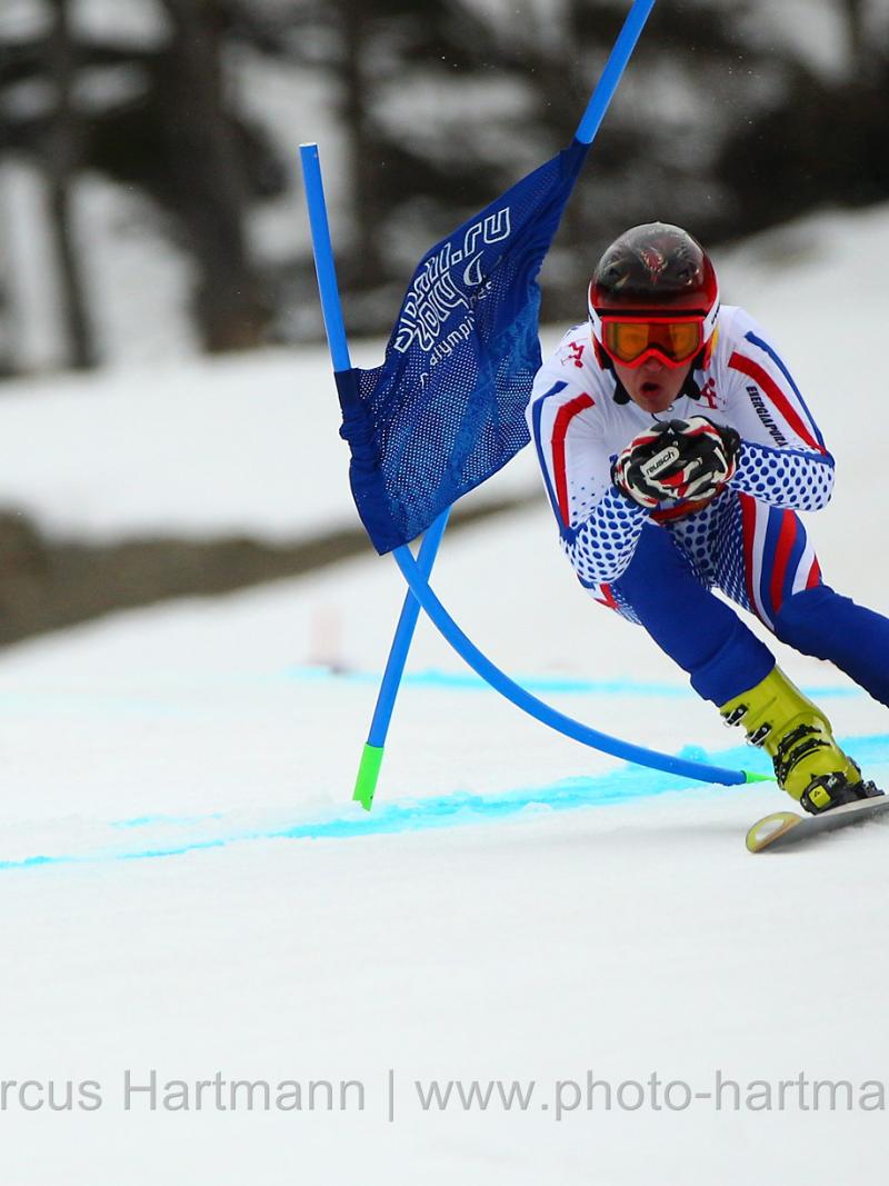 Alexey Bugaev, Russian Federation is so fast his speed moves the gates and takes the gold medal