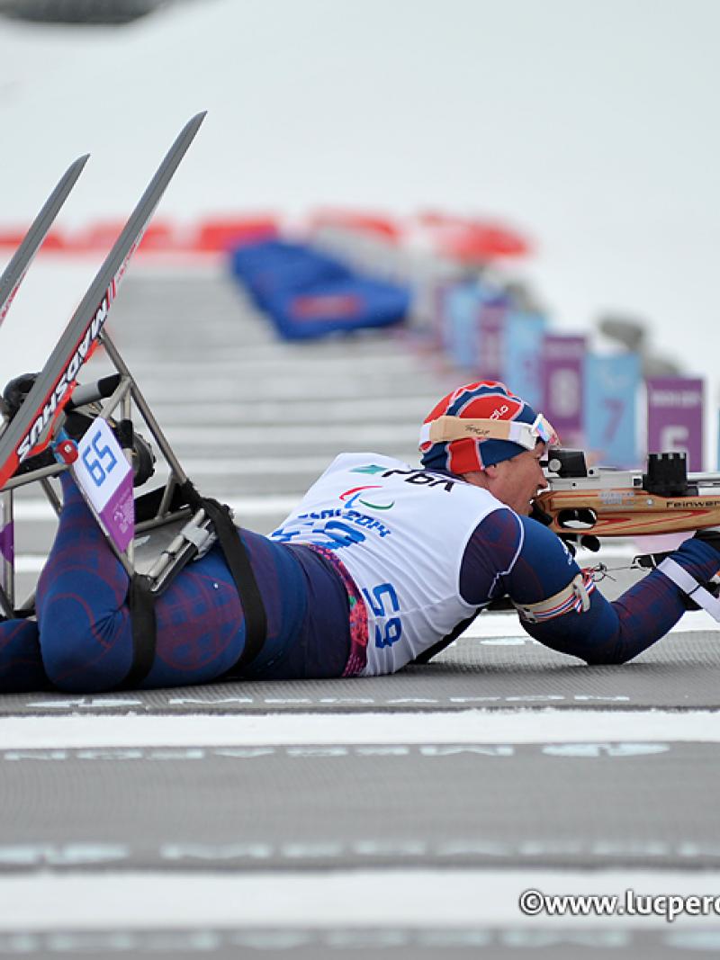 Trygve Steinar Larsen, Norway lines up his shot in biathlon.