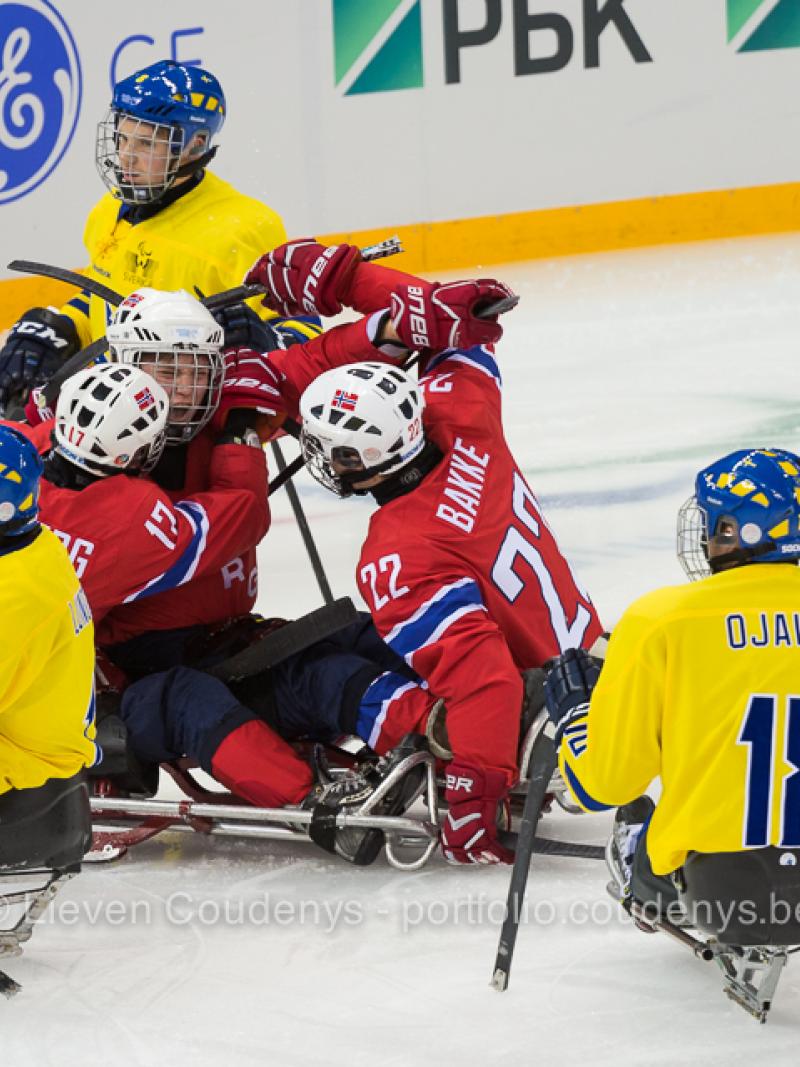 five athletes in sledges on the ice