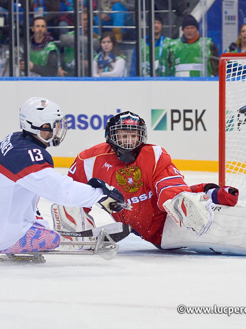 The USA's Josh Sweeney crashes the net during the Sochi 2014 Paralympic Winter Games.