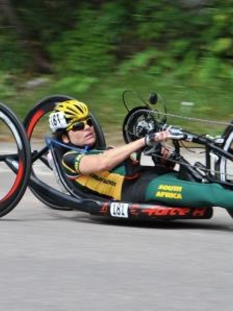 Women in hand-bike racing on a road
