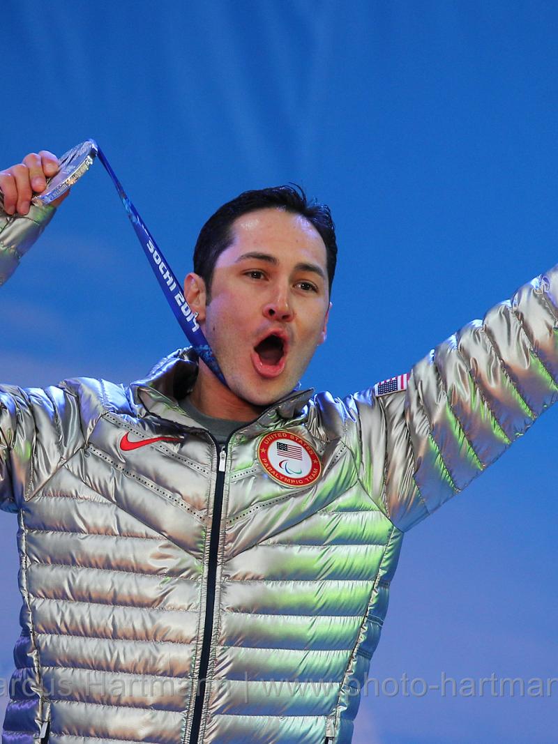 A US para-athlete celebrates winning a medal at the Paralympic Games.