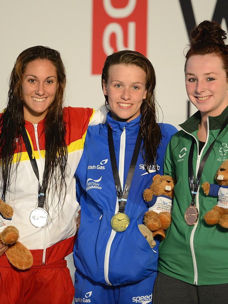 Three female swimmers, Sarai Gascon of Spain, Amy Marren of Great Britain and Ellen Keane of Ireland pose with their 100m butterfly S9 medals at the 2013 IPC Swimming World Championships