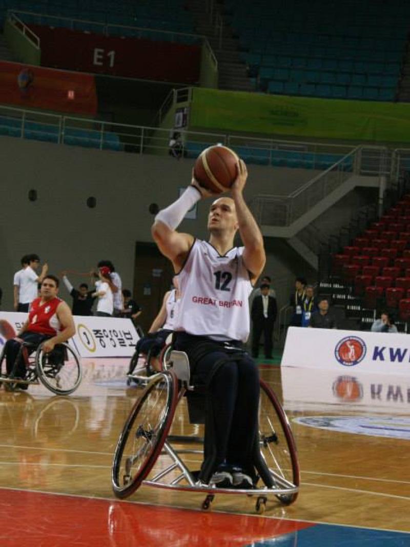 Wheelchair basketball player doing s free shot