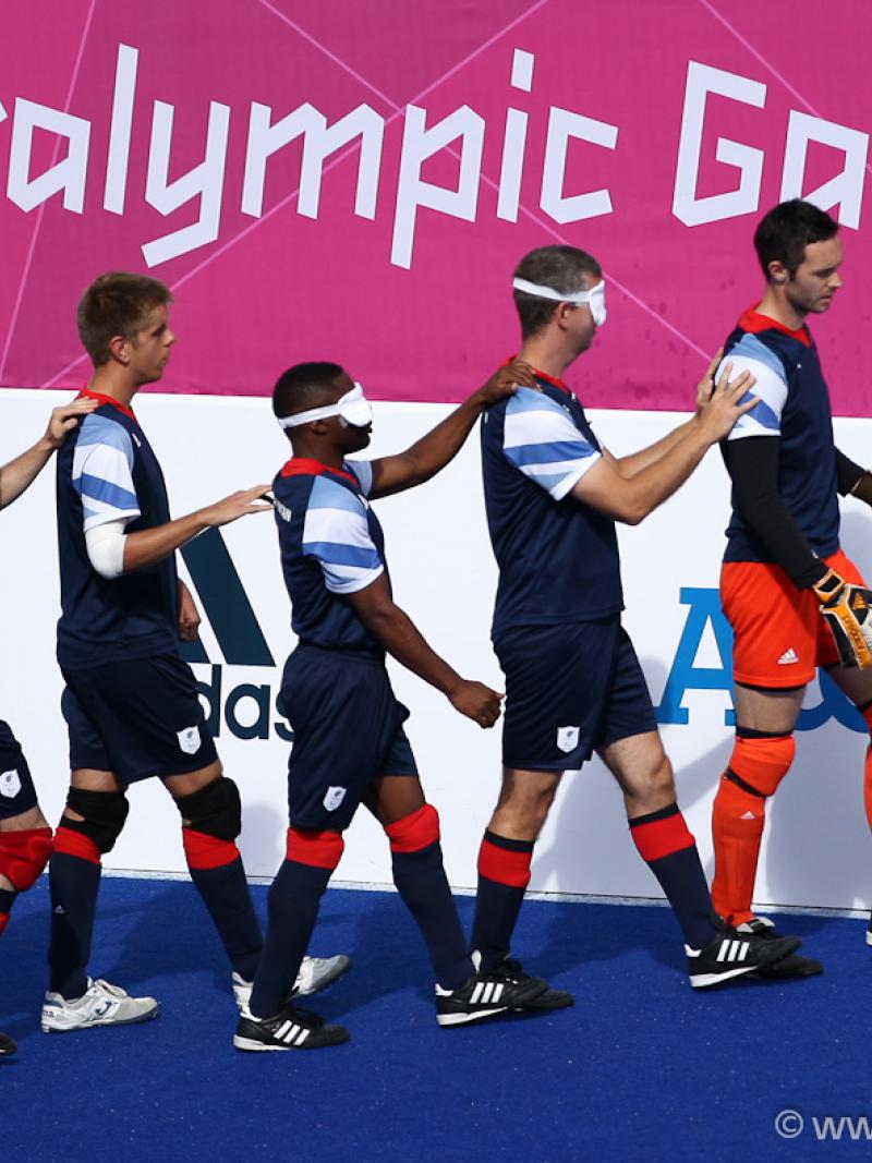 Team Great Britain marching onto the field led by their goalkeeper in the Football 5-a-side during the London 2012 Paralympic Games.
