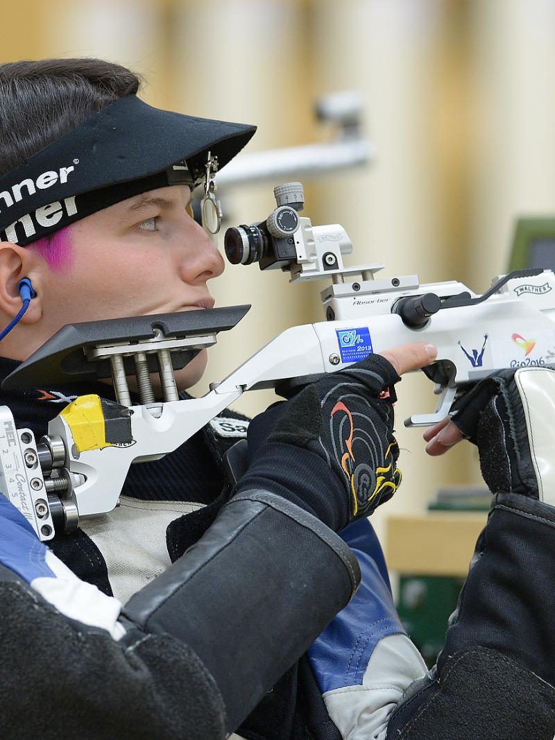 A female German shooter preparing for the next shot.