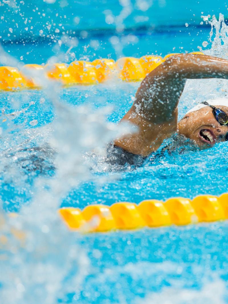 Women swimming a freestyle race