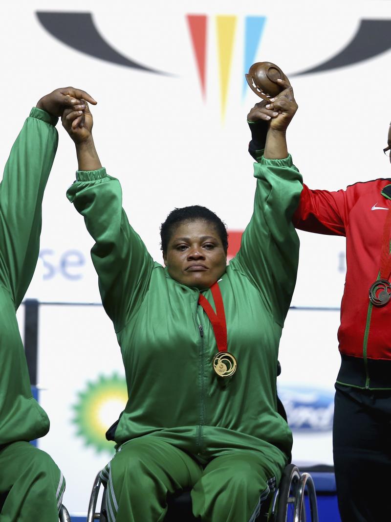 Three heavyweight female powerlifters on the podium at Glasgow 2014.