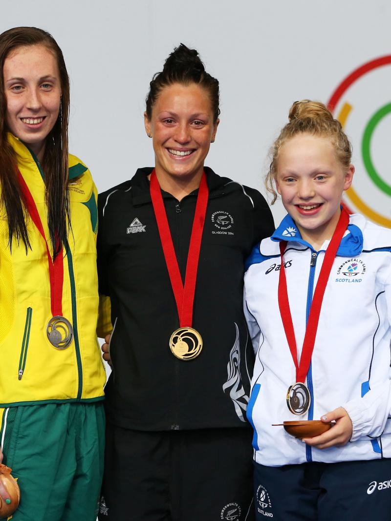 New Zealand's gold medallist Sophie Pascoe with silver medallist Madeleine Scott of Australia and bronze medallist Erraid Davies of Scotland during the medal ceremony for the Women's 100m Breaststroke SB9 Final at Glasgow 2014