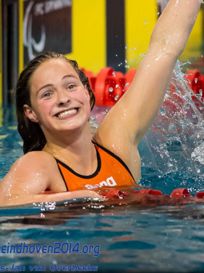 A Dutch swimmers celebrates winning gold at the 2014 IPC Swimming European Championships