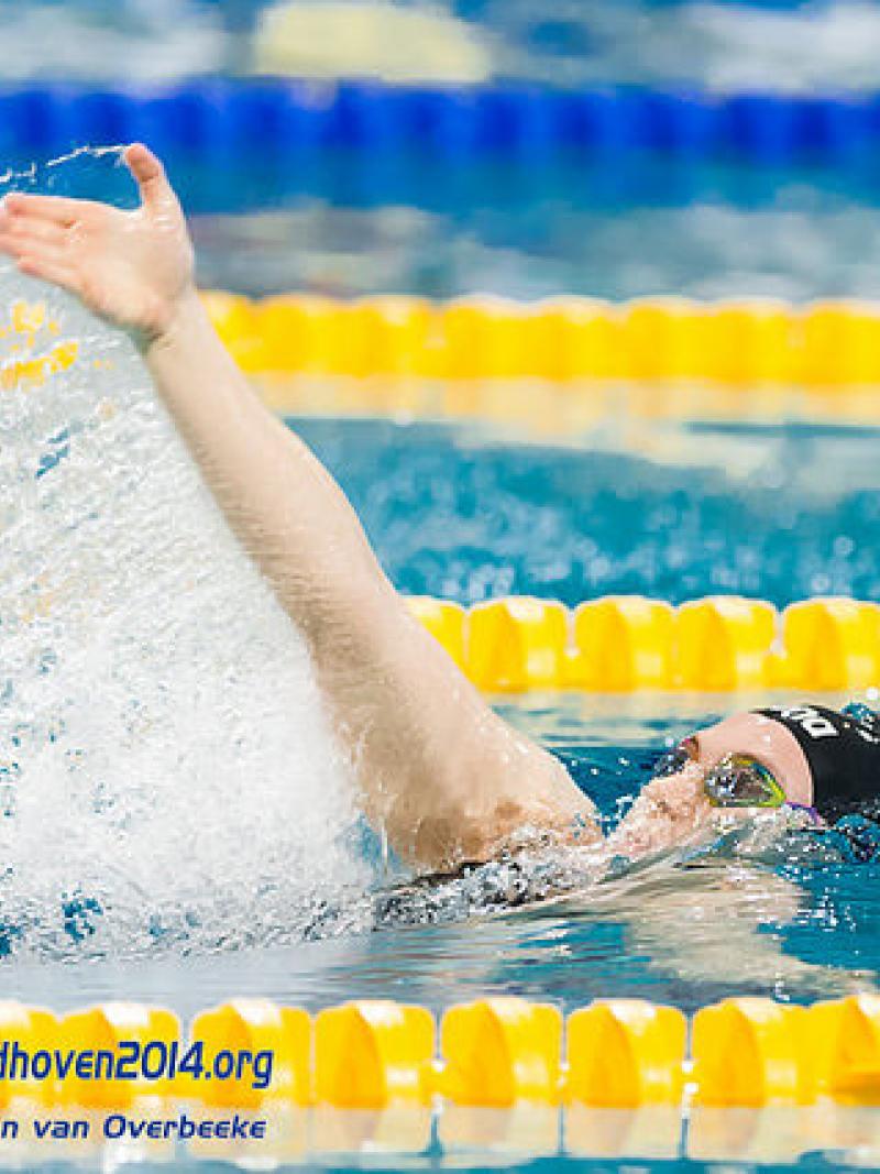 A female swimmer in a race at the 2014 IPC Swimming European Championships.