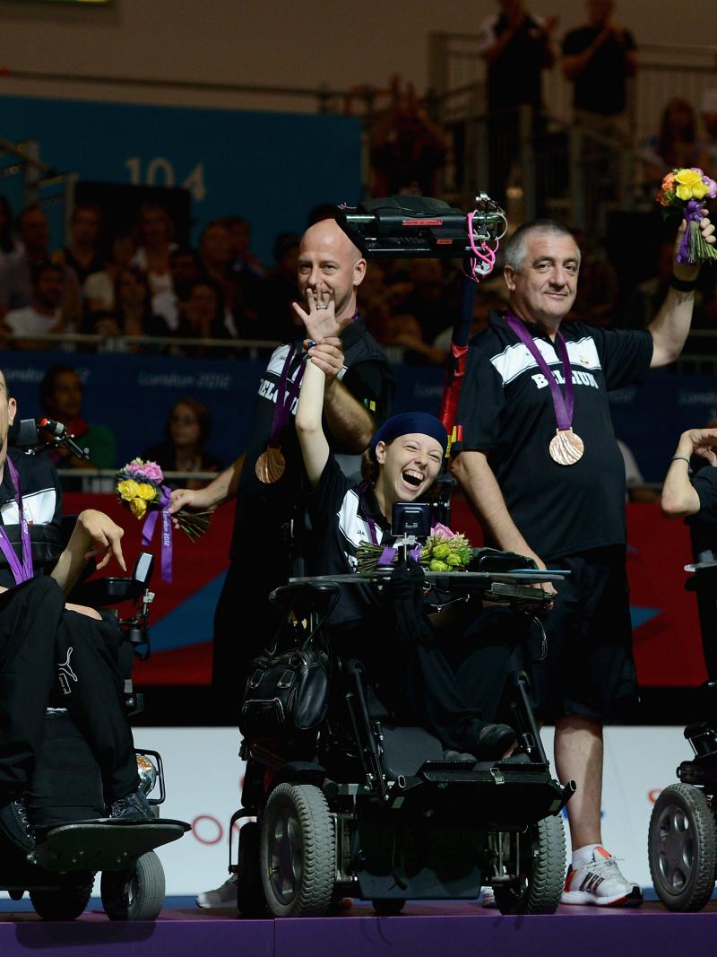 Pieter Cilissen, Kirsten De Laender and Pieter Verlinden of Belgium celebrate winning bronze in the Mixed Pairs Boccia - BC3 at the London 2012 Paralympic Games.