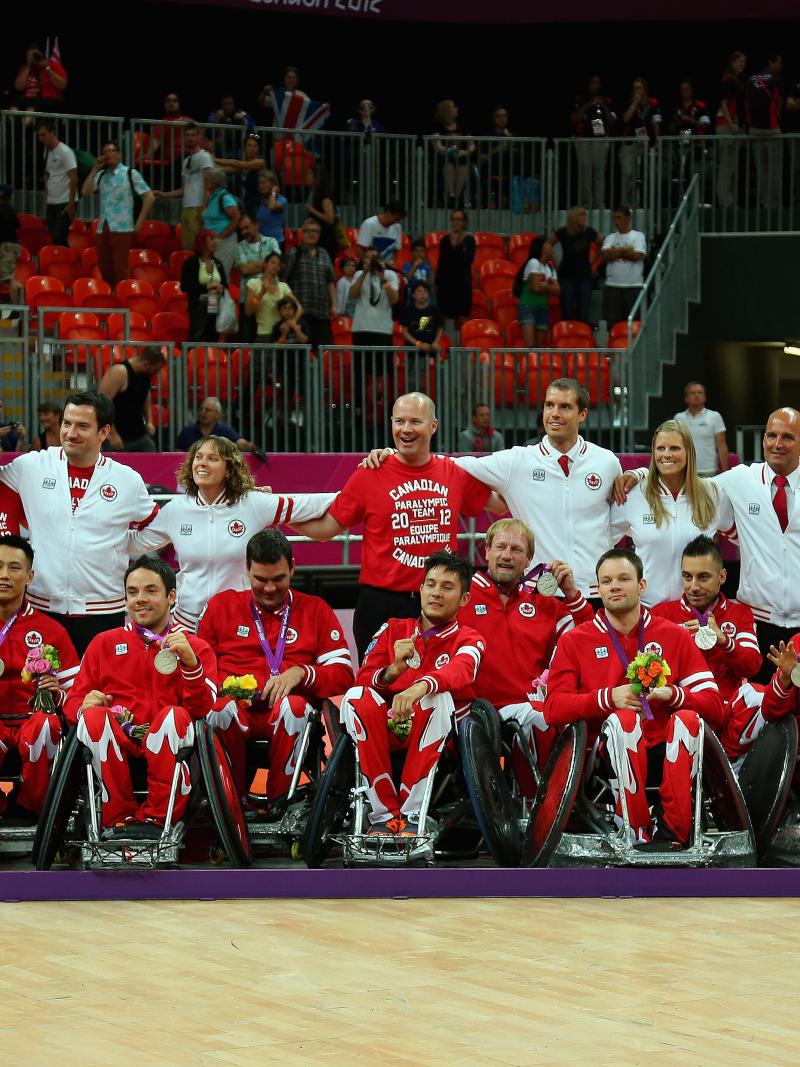Canadian men celebrating with their medals
