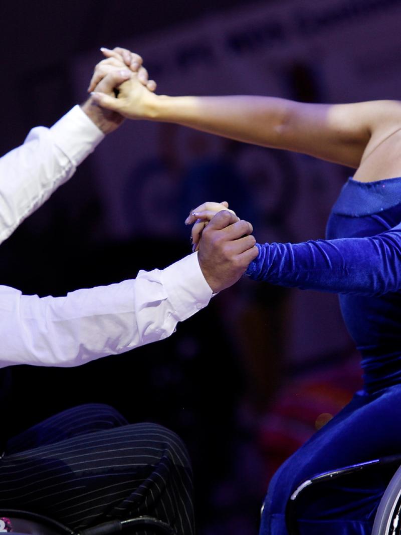 two wheelchair dancers in action
