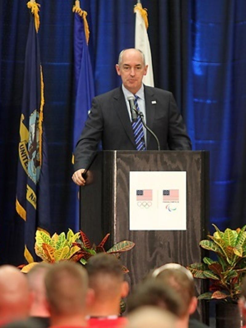 Man on podium doing a speech