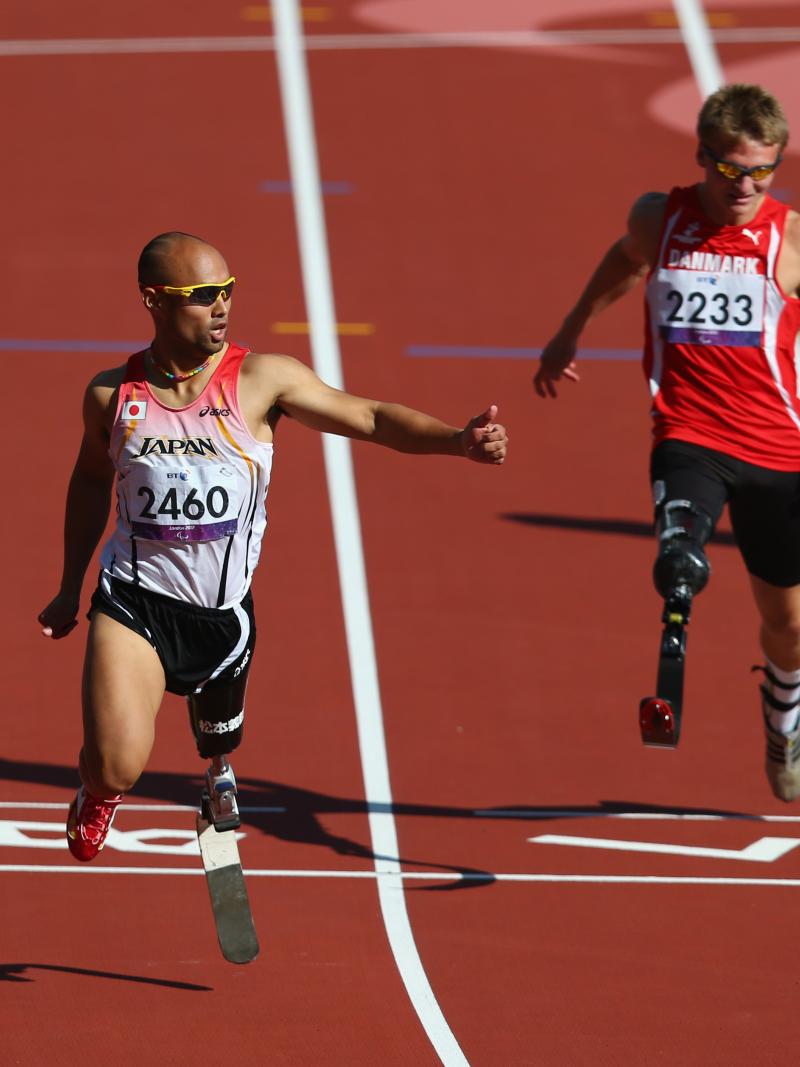 Atsushi Yamamoto of Japan and Daniel Jorgensen of Denmark compete in the men's 100m T42 heats at London 2012