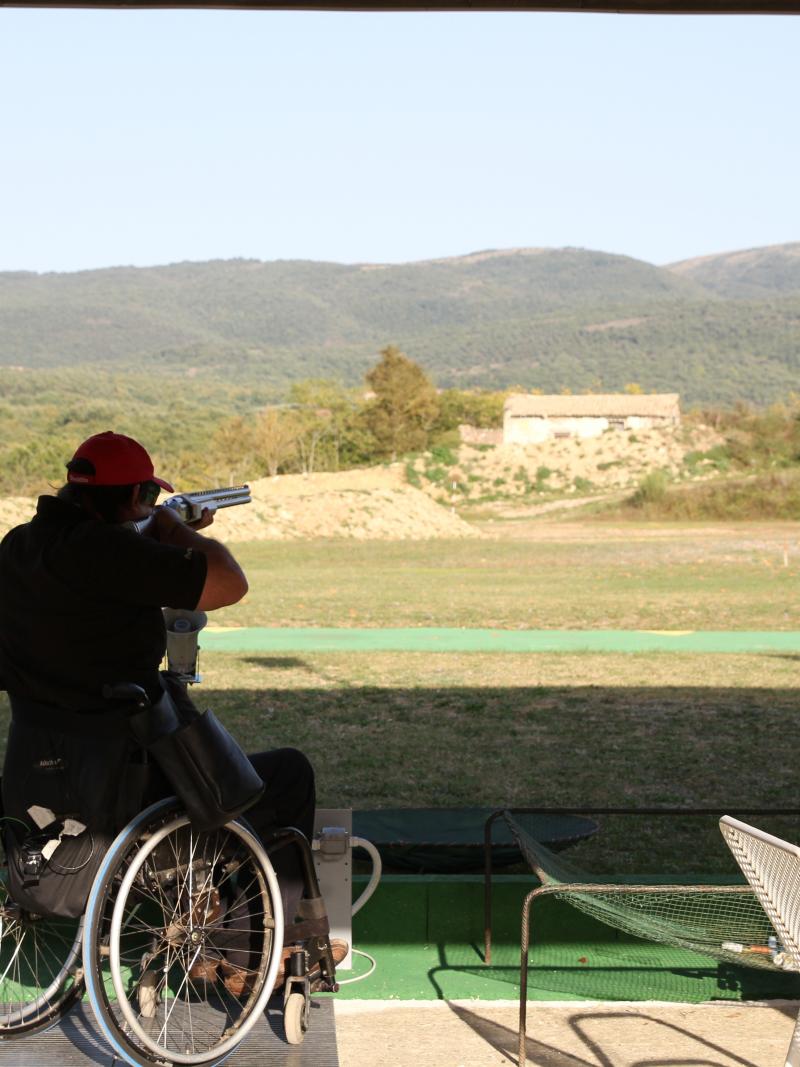 Man in wheelchair targets. Nice landscape in the background