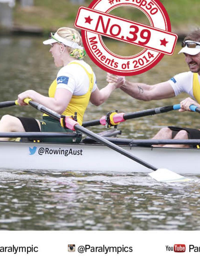 Kathryn Ross and Gavin Bellis hold hands in celebration in boat