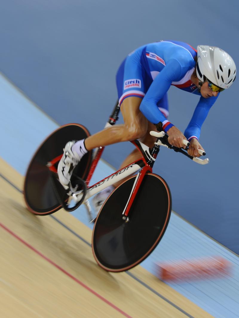 Man on a bike in racing suit, racing on a track