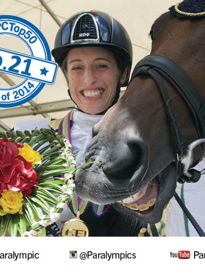 Women holding flower bouquet, a horse next to her