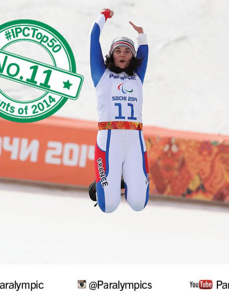 Marie Bochet jumps into the air to celebrate winning Paralympic gold at Sochi 2014.