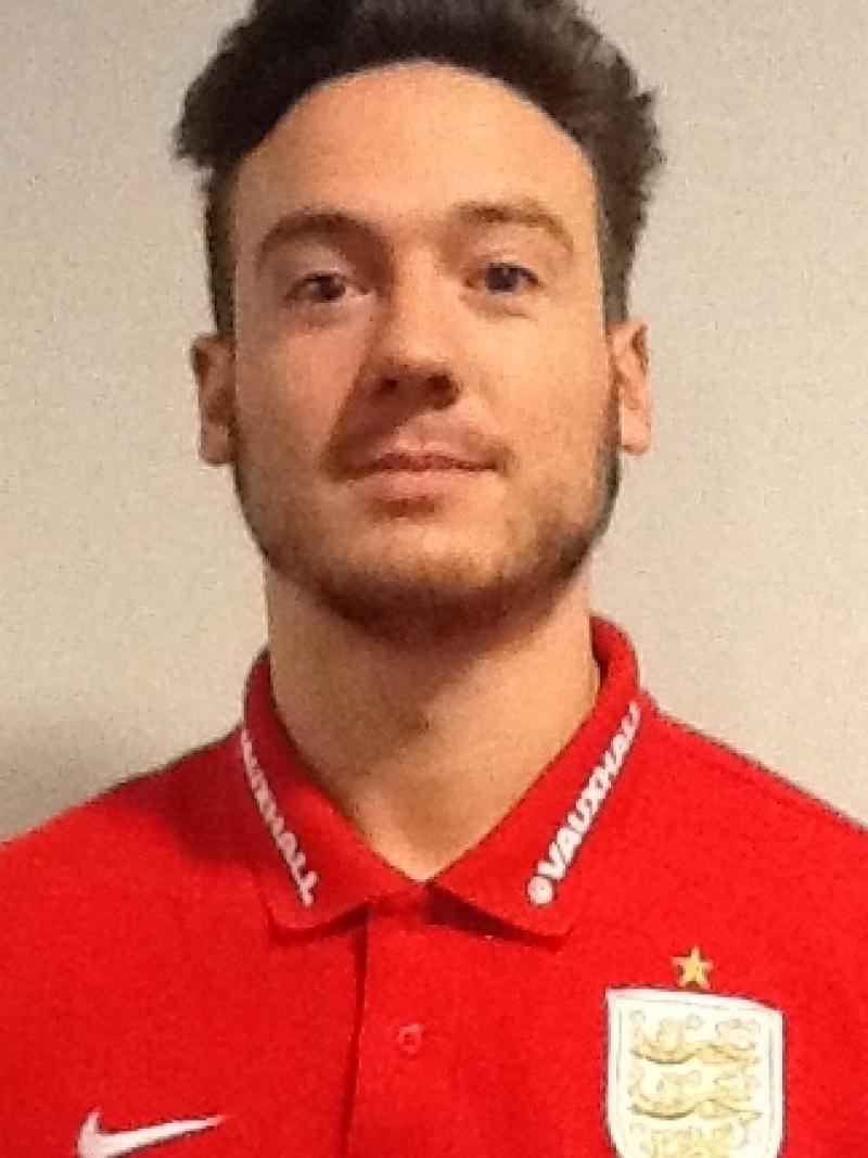 Portrait shot of young man wearing red polo