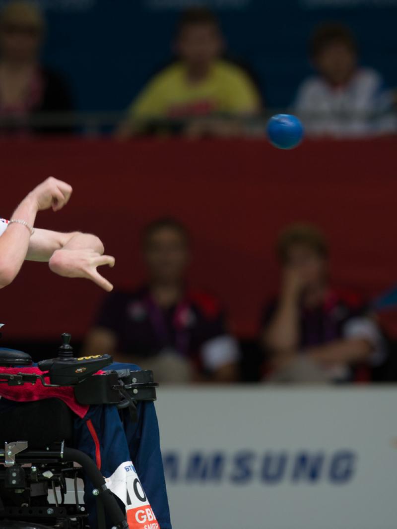 Man in wheelchair throwing a ball