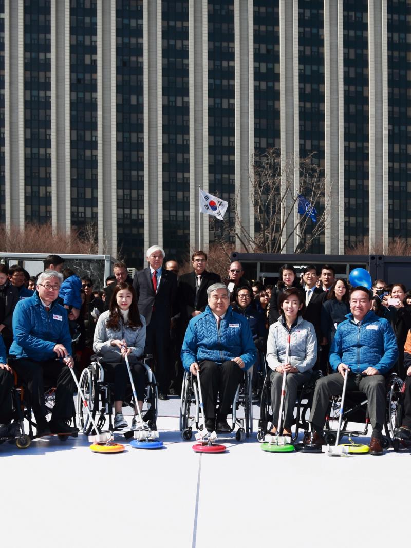 Participants at the first National Paralympic Day in South Korea get ready to try wheelchair curling.