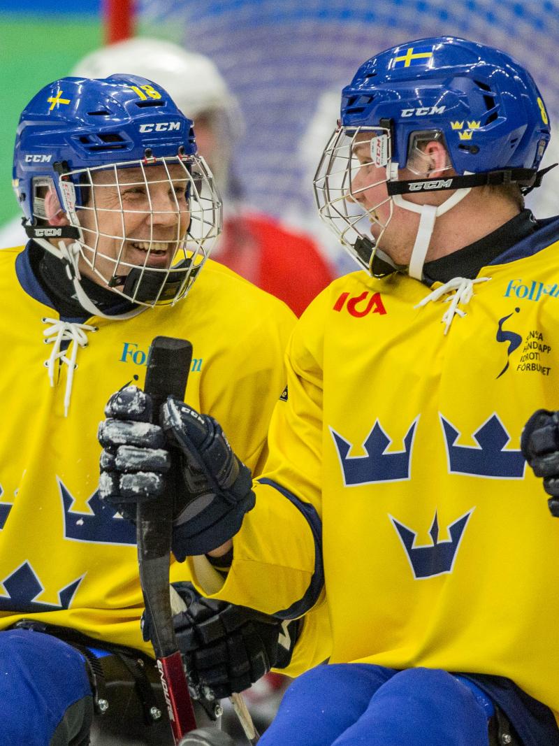 Per Kasperi celebrating with his teammate in the game against Austria at the 2015 IPC Ice Sledge Hockey World Championships B-Pool in Ostersund, Sweden.