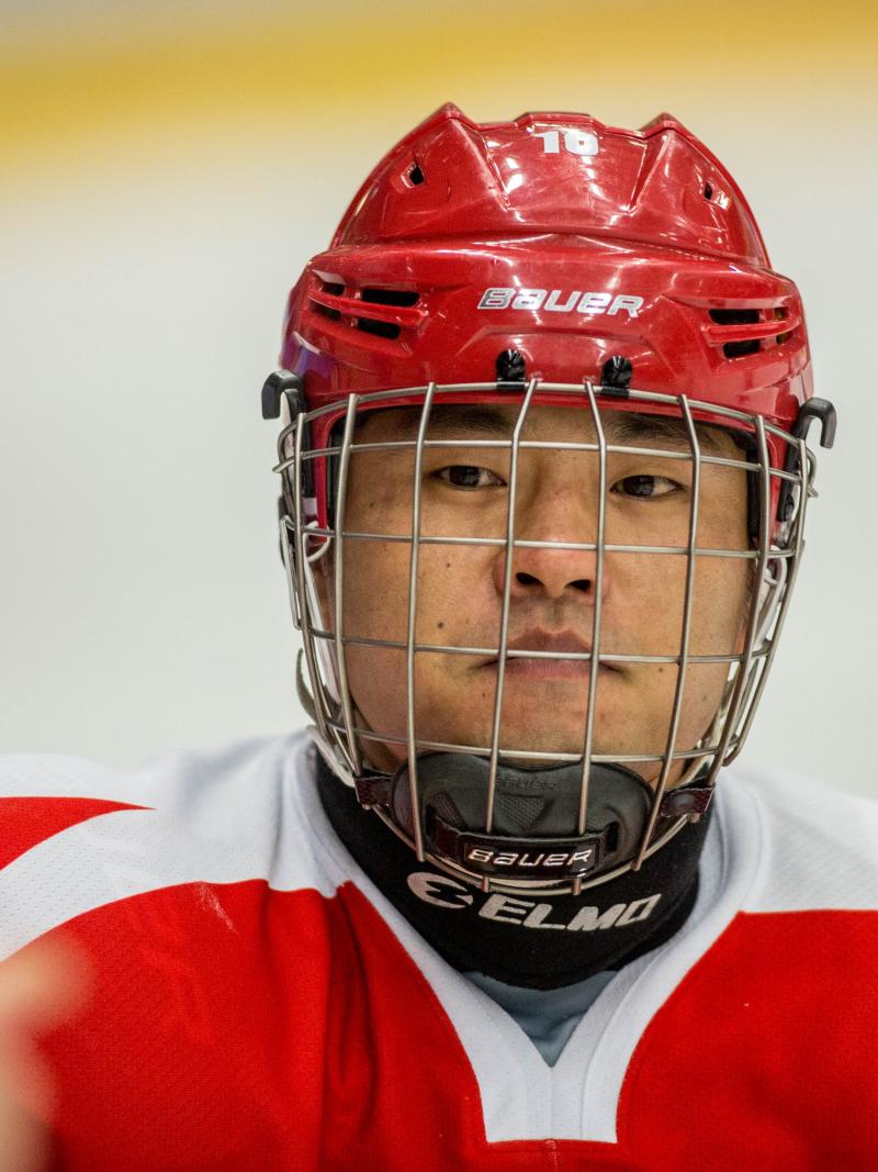 Man with helmet and red jersey