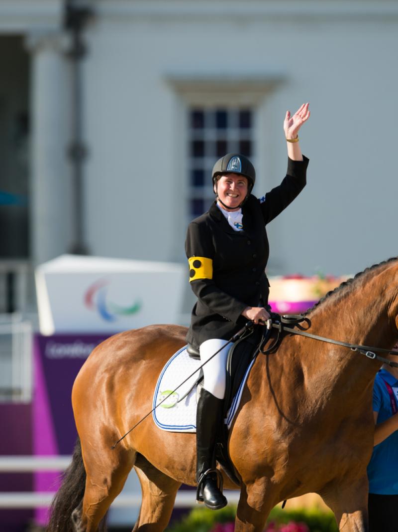 Katja Karjalainen of Finland celebrating her silver medal in the Mixed Dressage - Freestyle grade Ib at the London 2012 Paralympic Games.