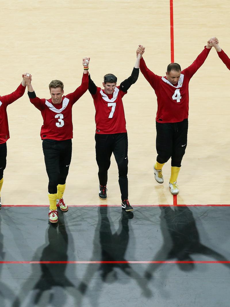 The Belgium team celebrate after their victory during the Men's Group B Goalball match between Belgium and Canada at the London 2012 Paralympic Games