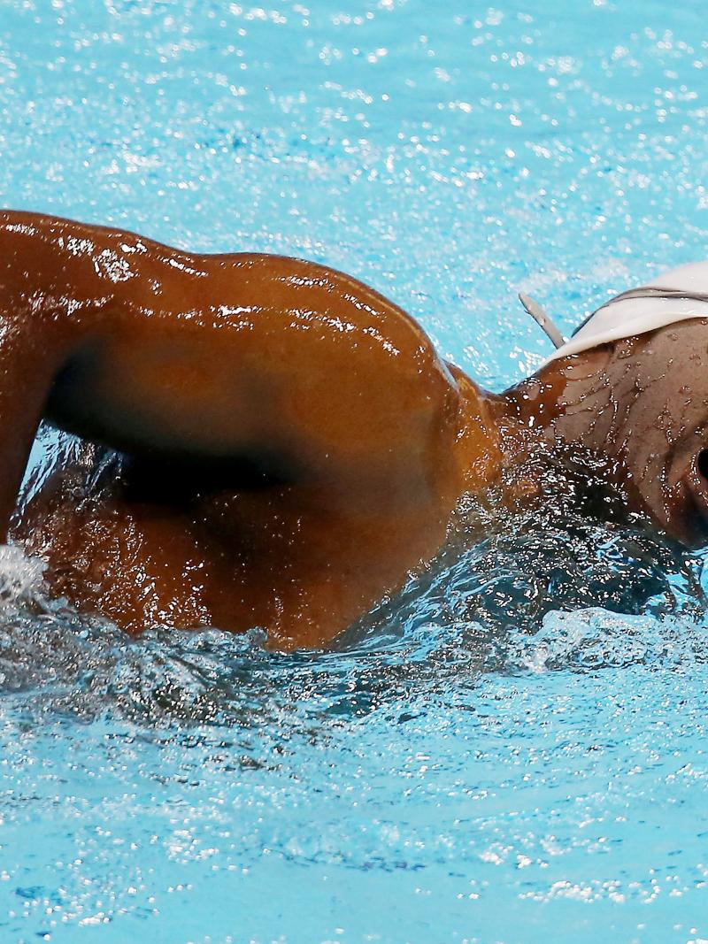 An S2 swimmer takes a breath during competition at London 2012.