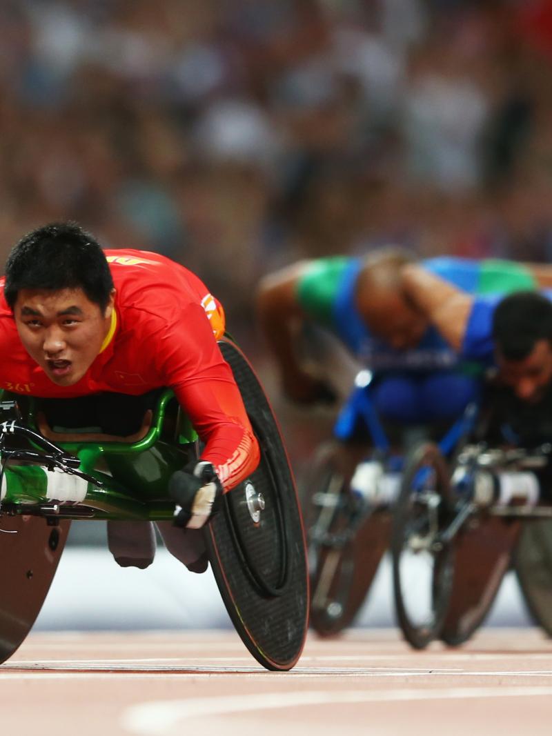 Huzhao Li of China crosses the line to win gold in the Men's 200m T53 Final at the London 2012 Paralympic Games.